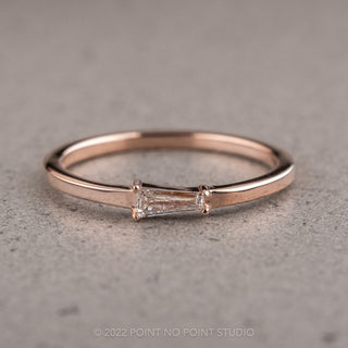 Dazzling .13 Carat White Tapered Baguette Diamond Ring set in 14K Rose Gold, highlighting its brilliant shine and elegance