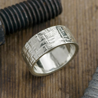 Frontal presentation view of a 10mm 14k White Gold Mens Wedding Band with distinct Textured and Polished finish