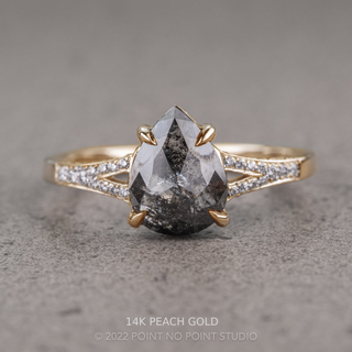 2.09 Carat Black Salt and Pepper Pear Diamond Engagement Ring, River Setting, Point No Point Studio. Available in a variety of metal types. Eco-friendly, Recycled Metals, Conflict Free.