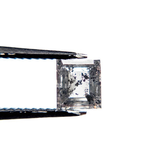 Clear black speckled princess cut diamond