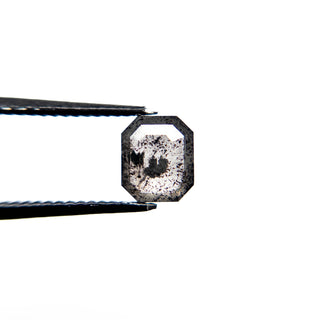 Black speckled emerald shaped diamond