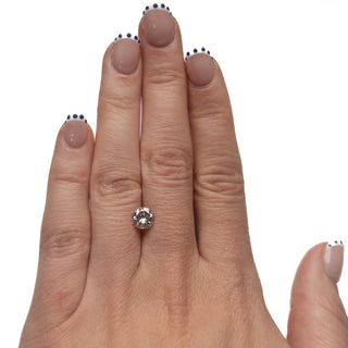 Hand wearing a 1.38 Carat Salt and Pepper Brilliant Cut Round Diamond showcasing a unique, eco-friendly, handcrafted alternative engagement ring design.