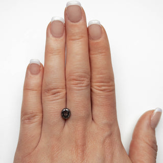 Black speckled oval diamond
