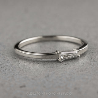 Beautiful .13 Carat White Diamond Ring, showcasing tapered baguette design set in 14K White Gold, side angle view