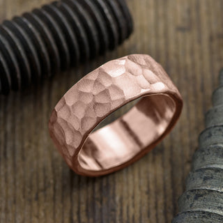 Beautiful 8mm 14K Rose Gold Mens Wedding Band with Hammered Matte Finish, highlighting the intricate pattern