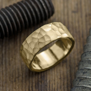 Detailed image of an 8mm 14k Yellow Gold Hammered Mens Wedding Band with a matte finish