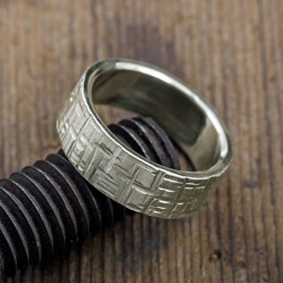 Detailed view of 8mm men's wedding band made from 14k white gold, displaying unparalleled texture and matte finish