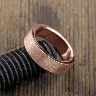Close-up view 14K Rose Gold Men's Wedding Band, 6mm width with a matte finish