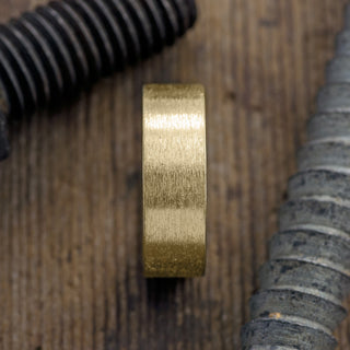 Close-up view of the matte finish on the 8mm 14k Yellow Gold Men's Wedding Band