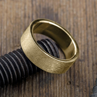 Detailed view of the interior inscriptions on the 8mm 14k Yellow Gold Men's Wedding Band, Matte Finish