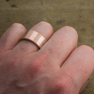 Close-up detail of the Brushed Matte Texture on a 14K Rose Gold Men's Ring