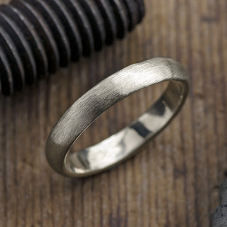 Front view of a 4mm 14K White Gold Men's Wedding Band, featuring a half round matte finish for a modern style
