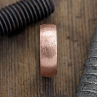 Top view of a 14K Rose Gold Men's Wedding Band, 8mm wide with a Half Round Matte surface