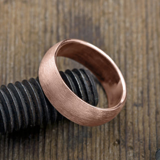 High quality 8mm 14K Rose Gold Men's Wedding Band, Half Round Matte, showcased in a clean and simple style