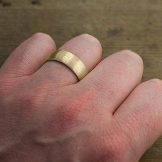 Close-up detail of the matte finish on the 8mm Yellow Gold Mens Wedding Band