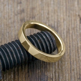 High-angle view of a 14k Yellow Gold Men's Wedding Ring with a 4mm design