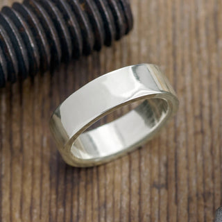 Shiny 6mm 14k white gold men's wedding band viewed from above