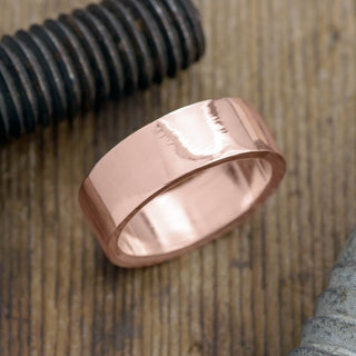 Elegant 8mm 14K rose gold men's wedding band with high polish finish, product view A