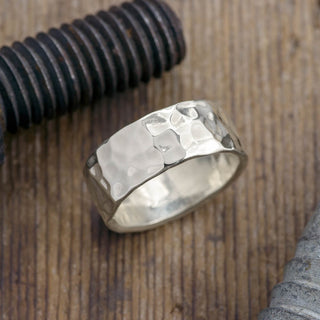 A classic 8mm, 14k White Gold Hammered Mens Wedding Band in a sleek high polish finish