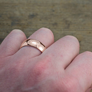 Detail View of Men's Wedding Band in Polished 14k Rose Gold, 8mm width