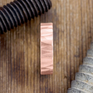 Close-up View of 6mm 14k Rose Gold Men's Wedding Ring with Wood Grain Texture