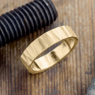 Elegantly presented 6mm 14k Yellow Gold Mens Wedding Band with Matte Wood Grain finish
