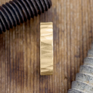 Unique textured design of a 6mm 14k Yellow Gold Mens Wedding Band with Wood Grain Finish