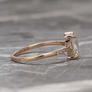 Detail of the 14K rose gold band and Jules setting on a 1.55 carat emerald cut diamond engagement ring