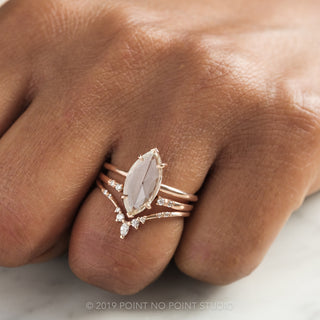Close-up of 1.35 carat marquise diamond engagement ring in Jane setting, 14K rose gold detailing