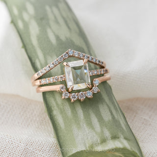 1.55 carat emerald shaped diamond engagement ring in 14K rose gold with Jules setting presented in elegant box