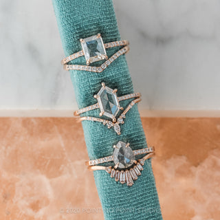 Hand model showcasing a 1.55 carat clear emerald cut diamond ring in 14K rose gold Jules setting