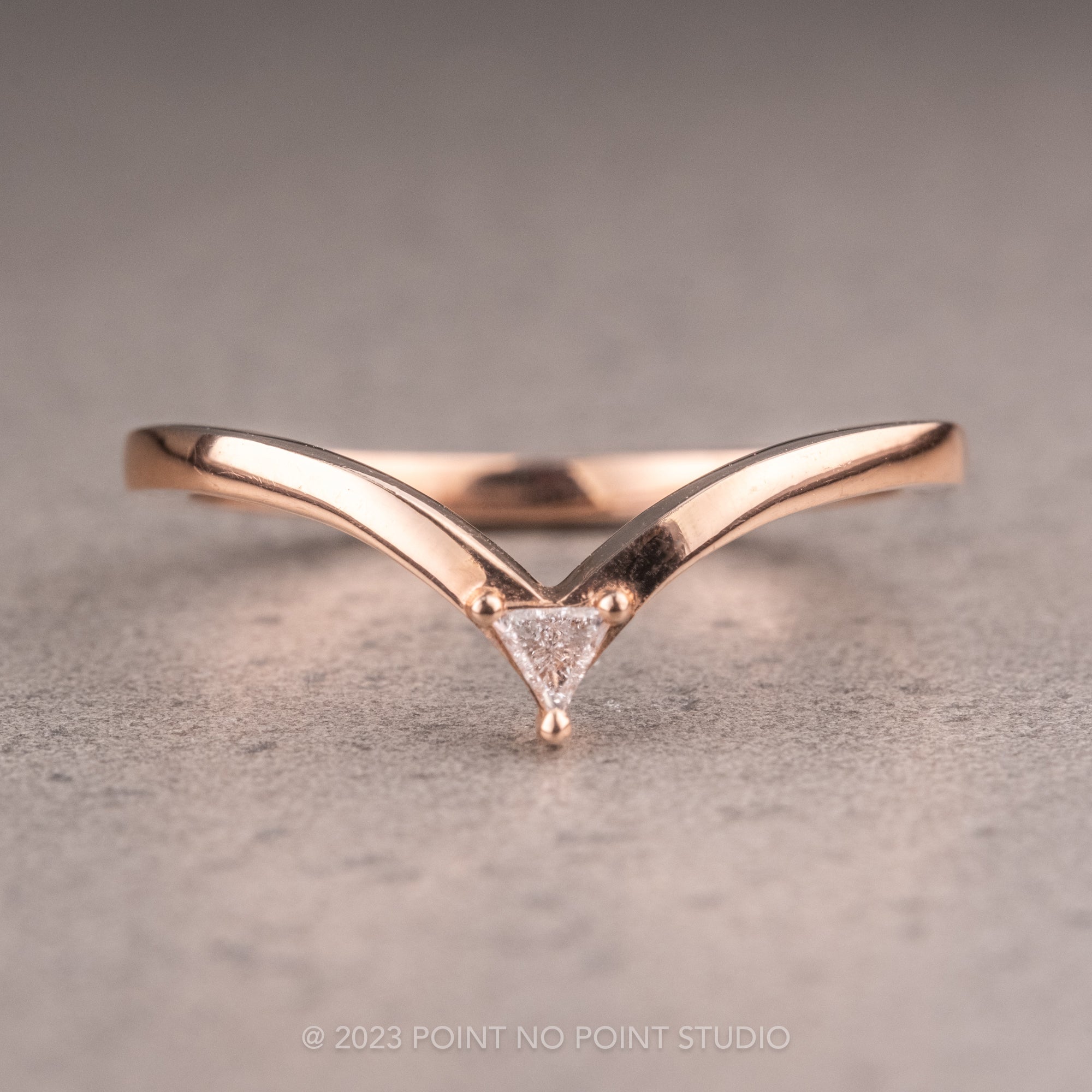 Matte finish goldplated open ring with hammered design in triangle shape. -